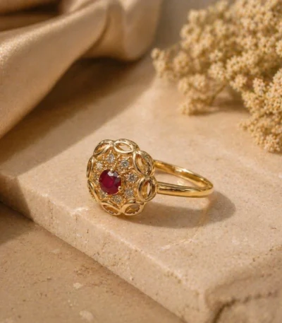 Gleaming red stone adjustable ring Pakistan with intricate gold cutwork and crystals
