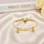 Gold heart charm bracelet Pakistan — adjustable puffy heart beaded cuff bangle by LumiraPK