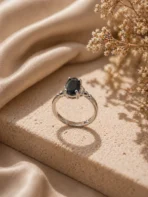 Adjustable black stone ring Pakistan with silver-tone band and oval crystal