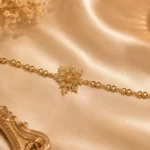 Crystal Snowflake Charm Bracelet with gold-tone detailing for elegant festive styling