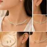 Woman wearing gold crystal V-shape necklace with matching rectangular stud earrings