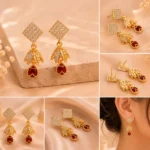 Crystal leaf earrings with ruby red drop stone detailing