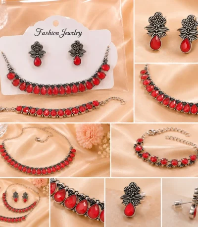 Vintage oxidized jewelry set with floral earrings and red teardrop stones