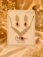 Red crystal necklace set with matching earrings displayed on jewelry card
