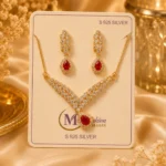 Red crystal necklace set with matching earrings displayed on jewelry card