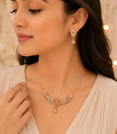 Woman wearing rose gold floral crystal necklace with matching earrings