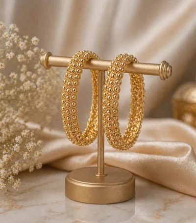 Textured gold hoop bangles Pakistan with elegant luxe detailing