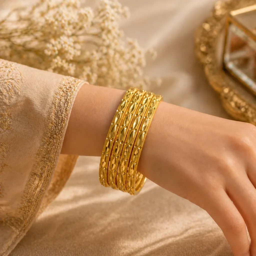 Set of 6 gold churi set Pakistan with traditional embossed patterns on wrist