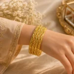 Set of 6 gold churi set Pakistan with traditional embossed patterns on wrist