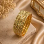 Gold engraved bangles set Pakistan with traditional textured detailing