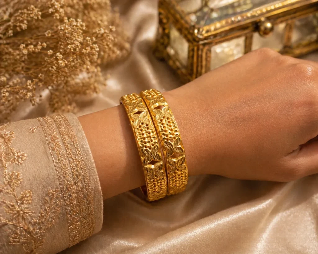 Two alluring gold plated floral bangles Pakistan style with traditional engraved details
