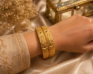 Two alluring gold plated floral bangles Pakistan style with traditional engraved details