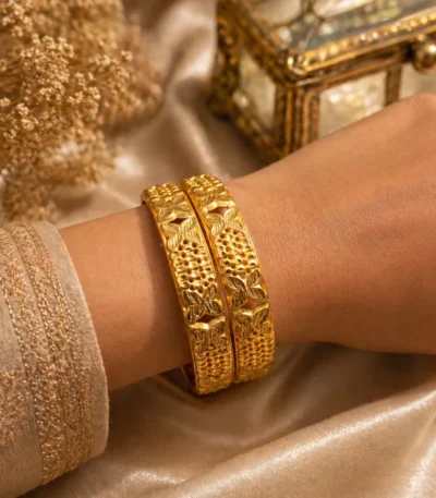 Two alluring gold plated floral bangles Pakistan style with traditional engraved details