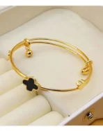 gold clover bracelet Pakistan with black luxury charm design