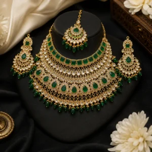 Emerald bridal necklace set Pakistan with kundan stones, green crystal drops, matching earrings, and maang tikka by Lumira PK