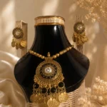 Black antique necklace set Pakistan featuring vintage coin charms, black stone detailing, and matching earrings by Lumira PK