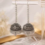 Silver oxidized long jhumka earrings for women with antique floral design and hanging beads for Pakistani ethnic wear