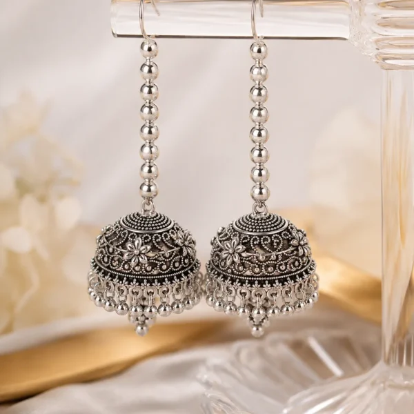 Silver oxidized long jhumka earrings for women with antique floral design and hanging beads for Pakistani ethnic wear
