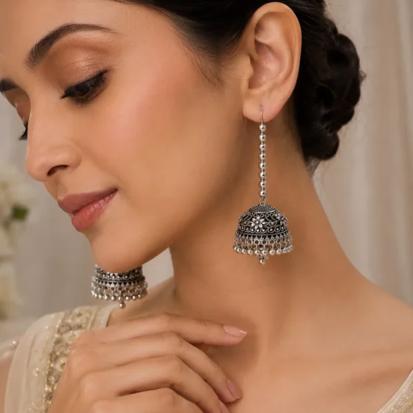 Silver oxidized long jhumka earrings for women with antique floral design and hanging beads for Pakistani ethnic wear