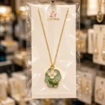 Gold plated floral pearl pendant necklace with blue enamel flower design for women in Pakistan