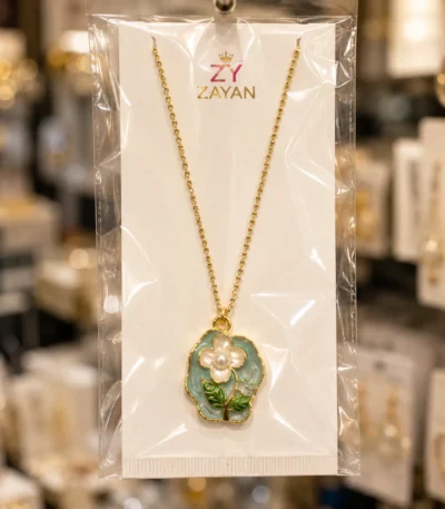Gold plated floral pearl pendant necklace with blue enamel flower design for women in Pakistan