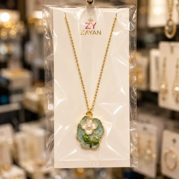 Gold plated floral pearl pendant necklace with blue enamel flower design for women in Pakistan