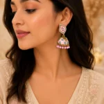Pink meenakari jhumka earrings with crystal accents and bead drops for festive wear in Pakistan by Lumira PK