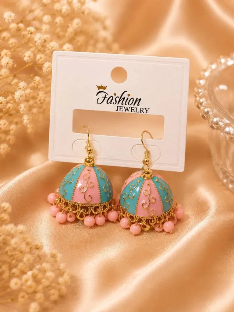 Pastel jhumka earrings Pakistan with pink and turquoise enamel detailing, gold accents, and pink bead drops by Lumira PK