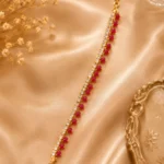 Ruby crystal anklet with red bead accents and sparkling crystal stones on a gold-tone chain by Lumira PK Pakistan