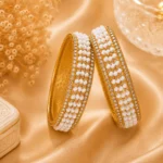 Pearl beaded bangles set Pakistan featuring white beadwork, crystal accents, and gold-tone detailing by Lumira PK