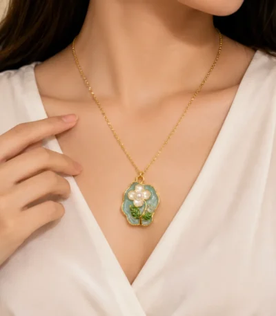 Gold plated floral pearl pendant necklace with blue enamel flower design for women in Pakistan